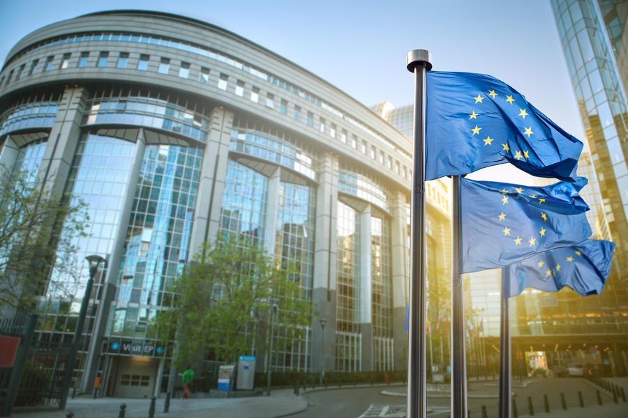 European union flag against parliament in Brussels, Belgium