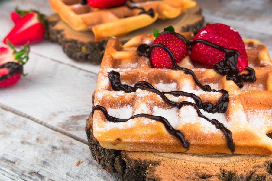 Belgium waffles with strawberries and chocolate. Top view