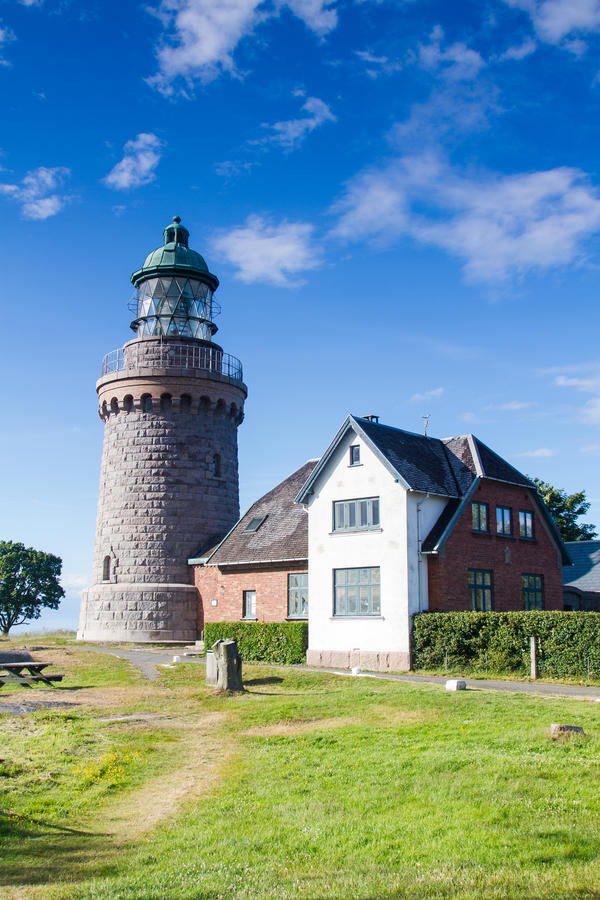 Typical Bornholm architecture with a smokehouse chimney which are used to smoke herrings - one of bornholm famouse dishes.