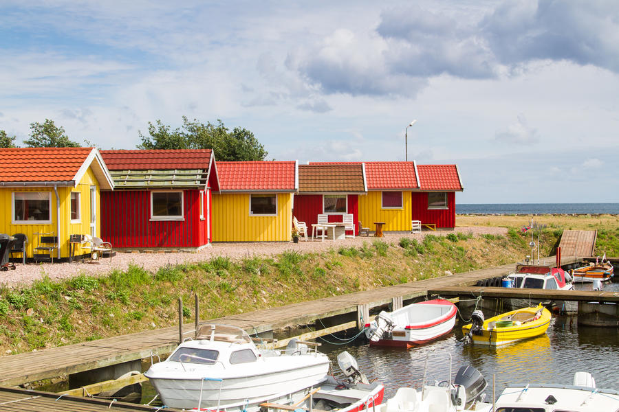 Red and yellow coastal wooden houses on Bornholm, Denmark