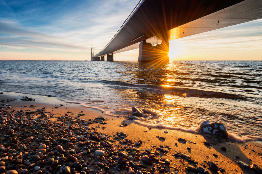 Photo of the Danish Great Belt Bridge at sunset.