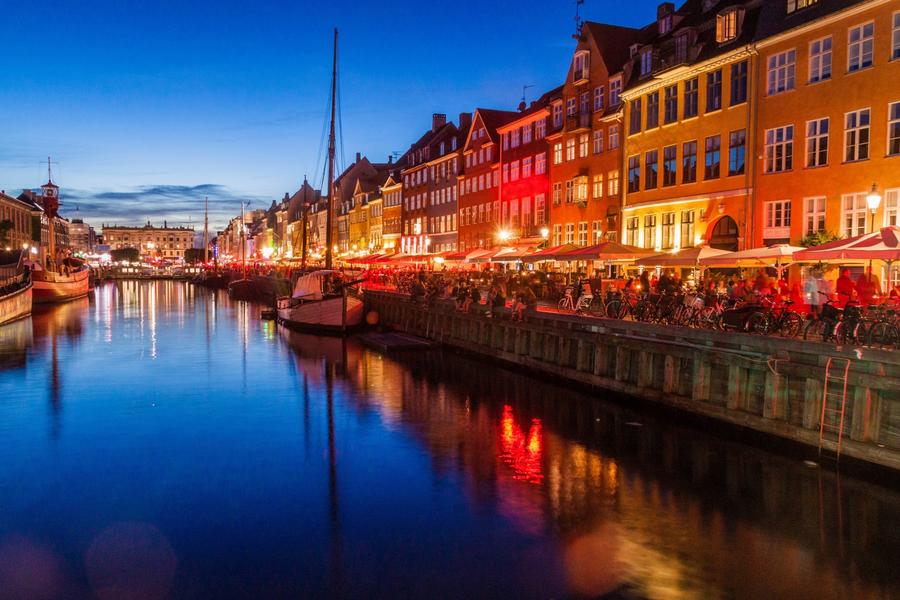 Evening view of Nyhavn district in Copenhagen, Denmark