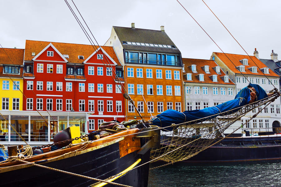 Copenhagen, Denmark. Yacht and color houses in seafront Nyhavn.