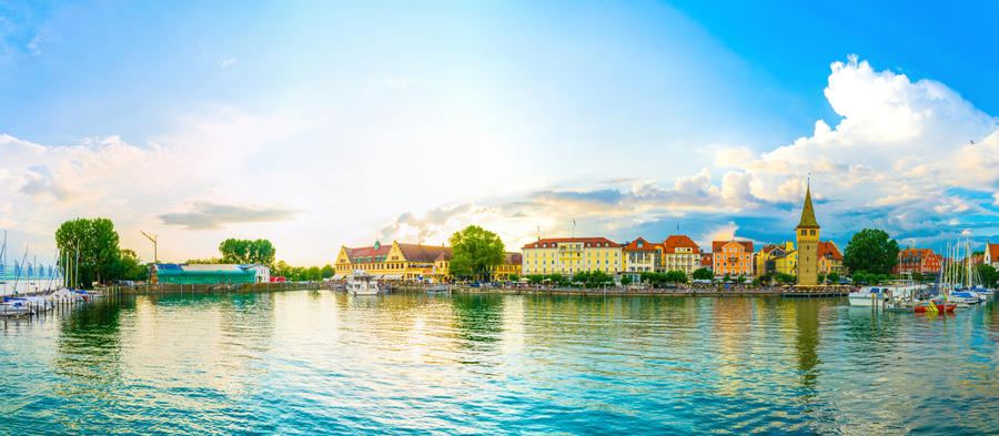 Panorama view of a port in the german city Lindau during sunset.