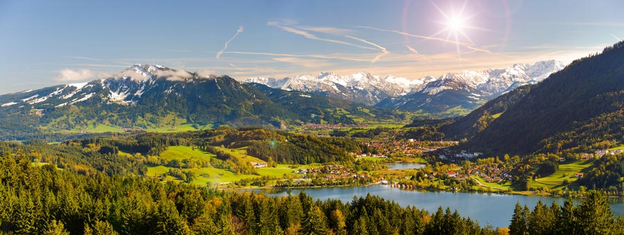 wide angle view to alps mountain range nearby lake Alpsee in region Allgaeu in Bavaria