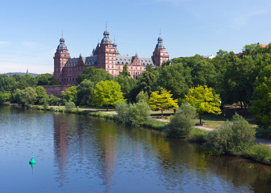 A summer view of the River Main and Schloss Johannisburg in the Bavarian city of Aschaffenburg.