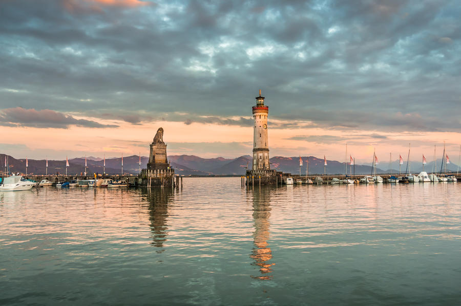 Evening seascape with lighthouse in harbor of Lindau in lake Constance, Germany