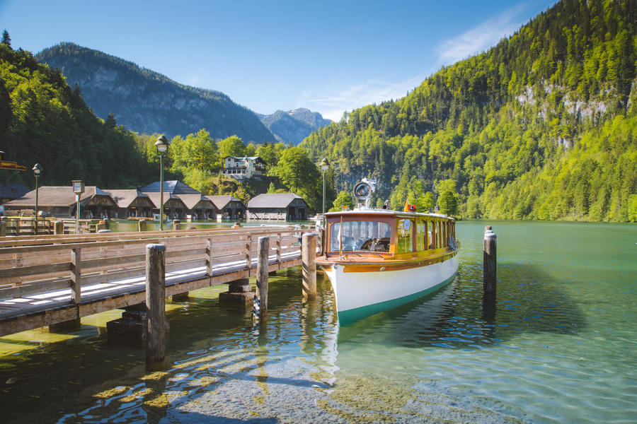Beautiful view of traditional passenger boat on scenic Konigssee lake on a sunny day in summer, Bavaria, Germany