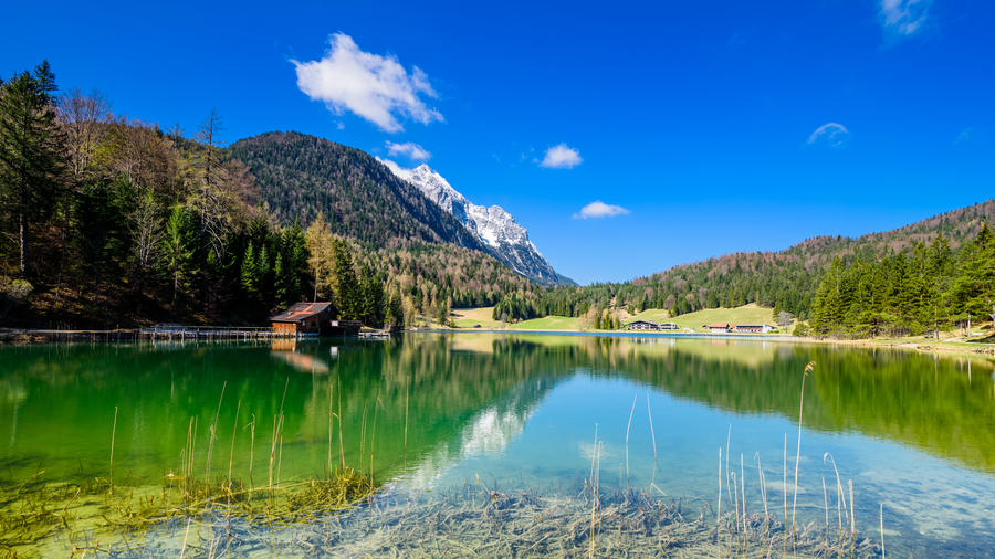 Alpspitze reflection in lake view from lautersee in mittenwald