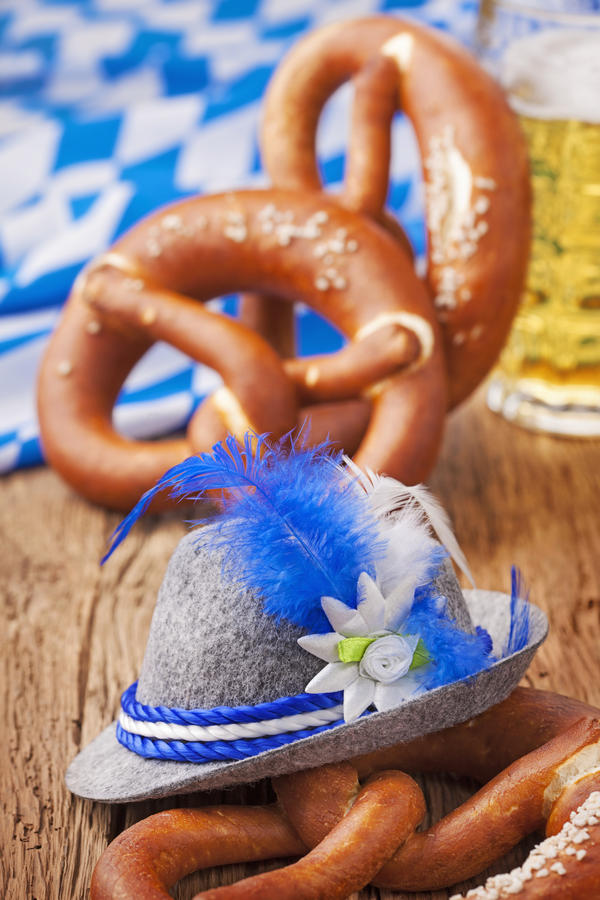 German bretzels and beer on wooden table