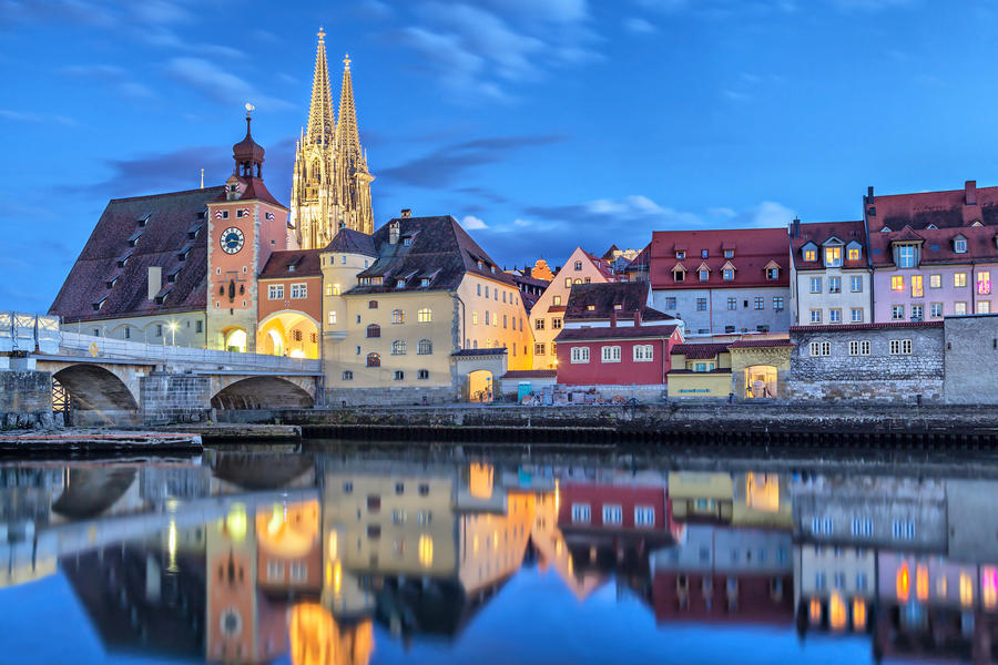 Historical Stone Bridge, Bridge tower and buildings in the evening, Regensburg, Germany