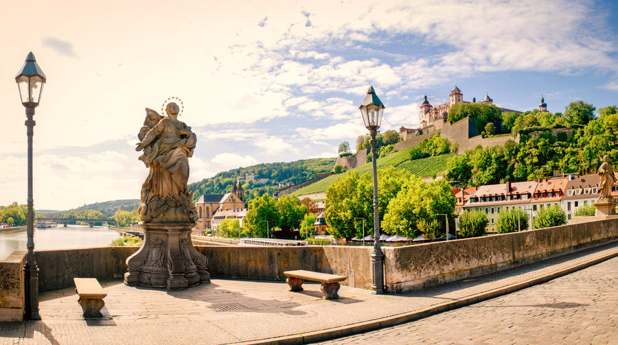Wuerzburg in late summer with old main(river) bridge and sculpture
