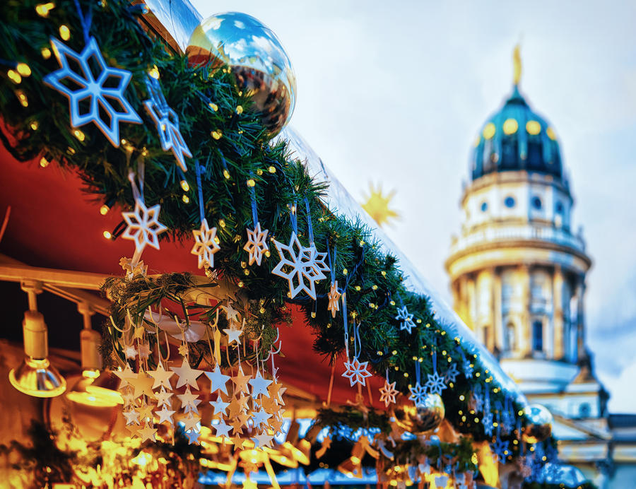 Night Christmas Market in Gendarmenmarkt at Winter Berlin, Germany. Advent Fair Decoration and Stalls with Crafts Items on the Bazaar.
