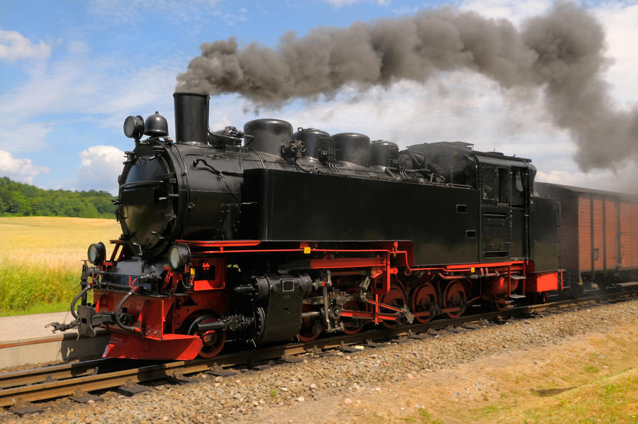 Steam train with black smoke; island Rugen, Northern Germany