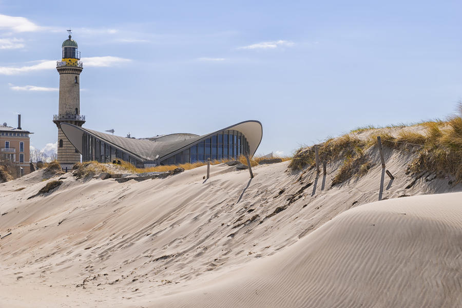 Image of the lighthouse of Warnemunde with sand dune and dune grass