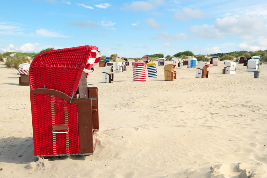 Typical striped chairs on German Borkum at the beach