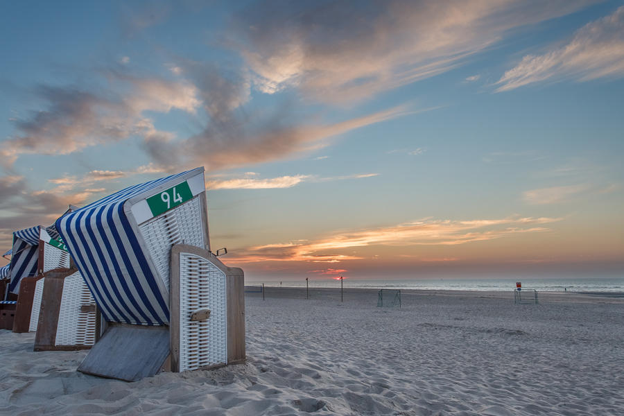 Beach chair in the sunset on the island of Norderney in the Germ
