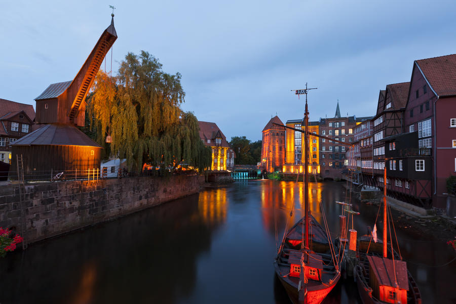 Historic harbor of Luneburg with old Crane and Watermills at night