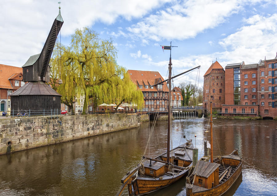 The historic harbor of Luneburg, the Old Crane and restored medieval ships