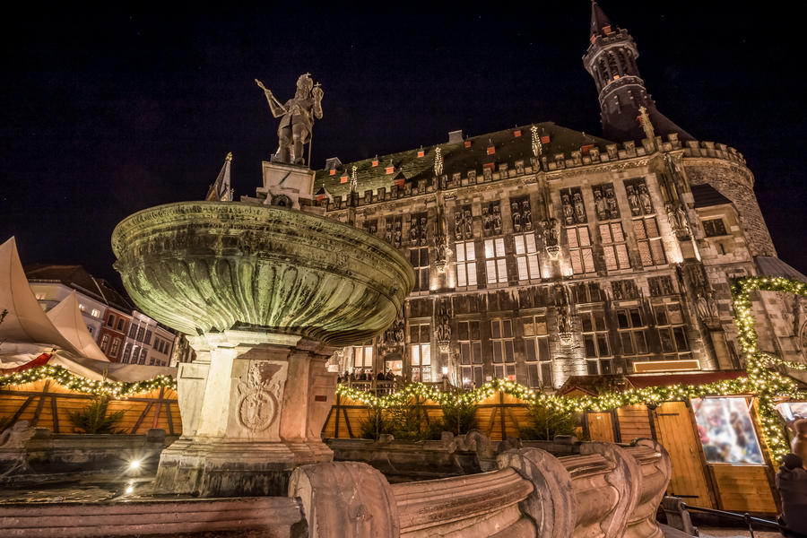aachen townhall with christmas market in the evening