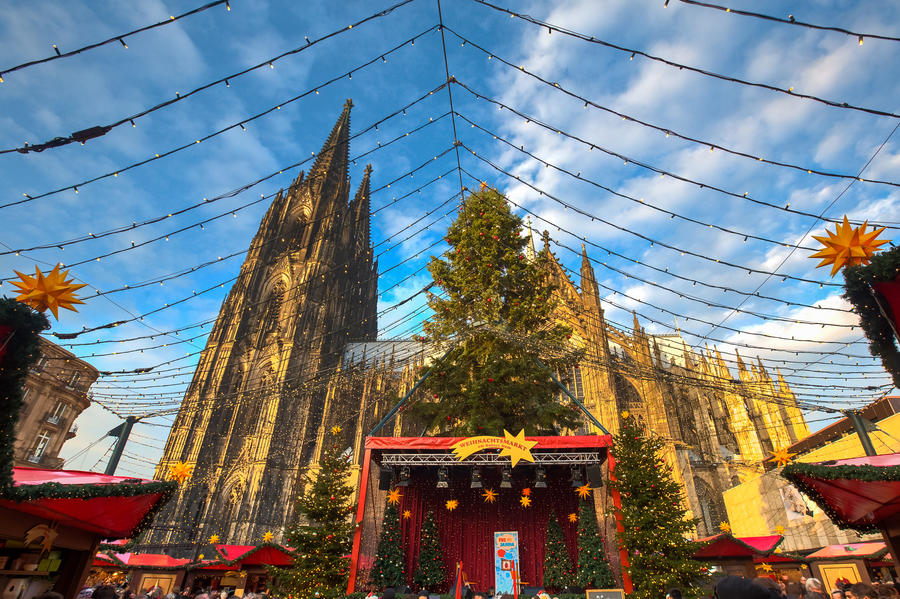 Christmas market near the Dom church in Cologne Germany in the evening sun