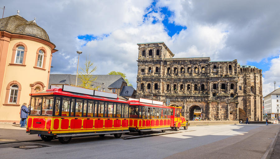 Porta Nigra with sightseeing road train - Trier, Germany