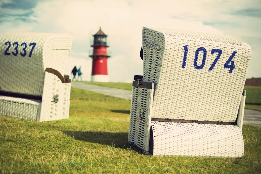 beach chairs an lighthouse at the German North Sea coast, Buesum, Germany, Europe, vintage style,  Strandkorb vor dem Leuchtturm in Buesum an der deutschen Nordseekueste, Deutschland, Europa