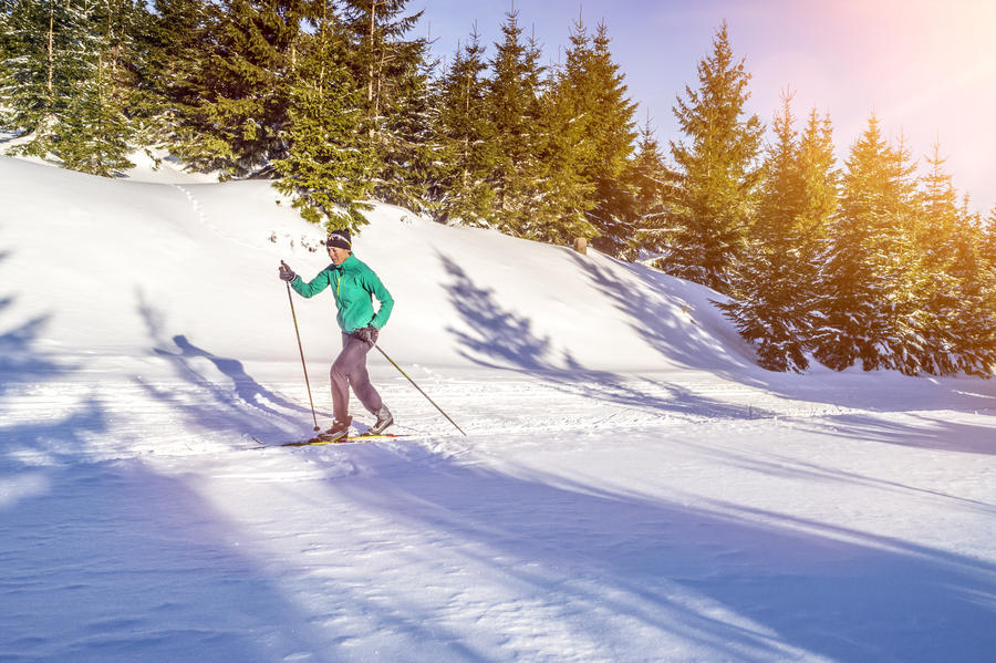Cross country skating in beautiful winter landscape