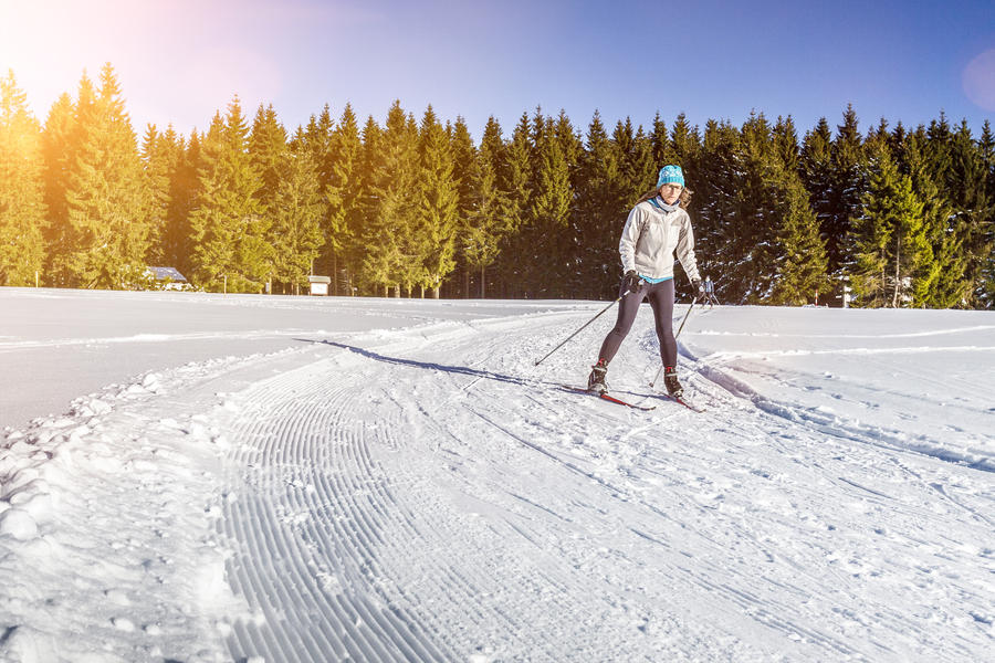 Cross country skating in beautiful winter landscape
