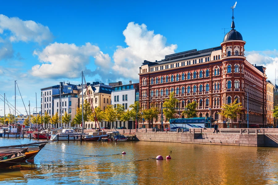 Scenic summer view of the Old Port pier architecture with ships, yachts and other boats in the Old Town of Helsinki, Finland