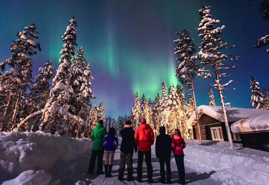 Beautiful picture of massive multicolored green vibrant Aurora Borealis, Aurora Polaris, also know as Northern Lights in the night sky over winter Lapland landscape, Norway, Scandinavia