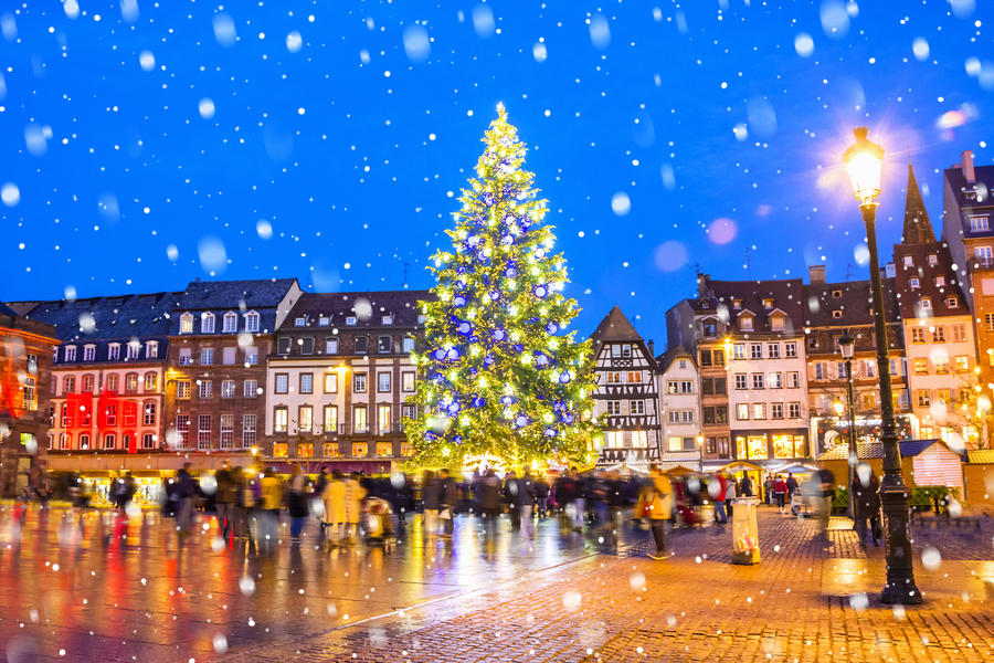 Christmas tree and xmas market at Kleber Square at night  in medieval city of Strasbourg - capital of Noel, Alsace, France.