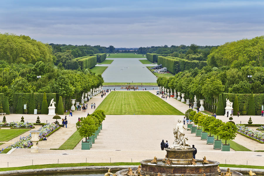Beautiful garden in a Famous palace Versailles. The Palace Versailles was a royal chateau. It was added to the UNESCO list of World Heritage Sites. Paris, France.