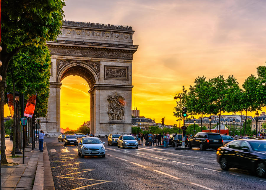 Paris Arc de Triomphe (Triumphal Arch) in Chaps Elysees at sunset, Paris, France. Architecture and landmarks of Paris. Postcard of Paris