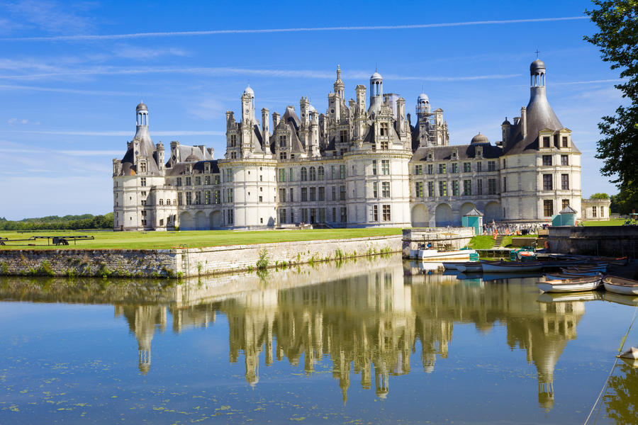 Chambord Chateau reflected in the canal, France