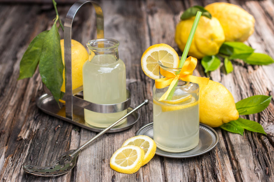 Fresh lemonade made of famous amalfi lemons on the old wooden board