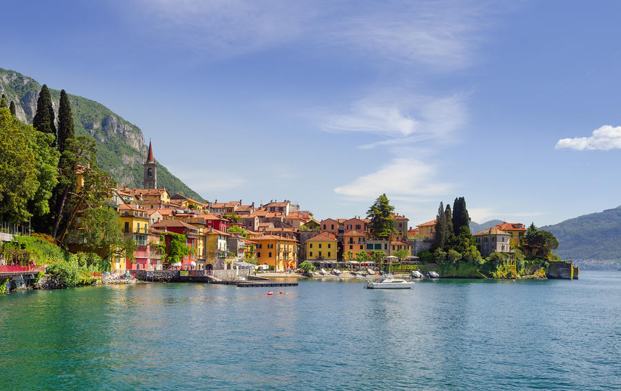 Colorful town Varenna seen from Lake Como on a sunny day
