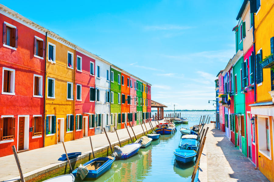Scenic canal with colorful buildings in Burano island, Venice, Italy