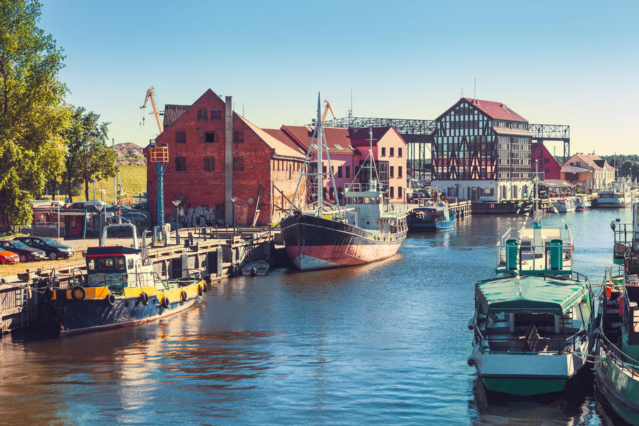 Ships and boats on Dane river in Klaipeda, Lithuania.