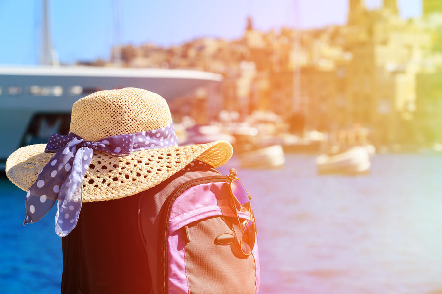 hat and backpack on vacation in Malta, europe travel