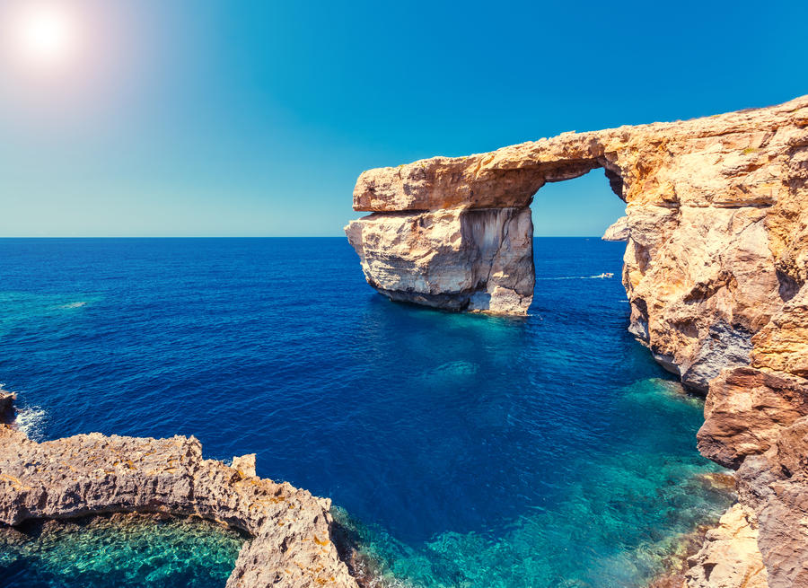 Fantastic views of rocky coast on a sunny day with blue sky. Picturesque and gorgeous scene. Location famous place Azure Window, Gozo island, Dwejra. Malta. Europe. Mediterranean sea. Beauty world.