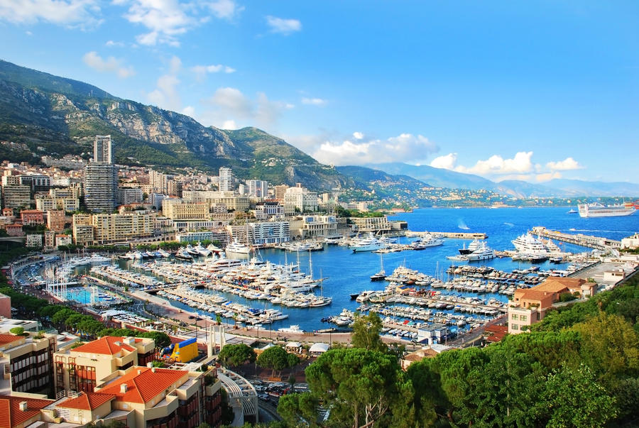 Monte Carlo city panorama. View of luxury yachts and apartments in harbor of Monaco, Cote d'Azur.