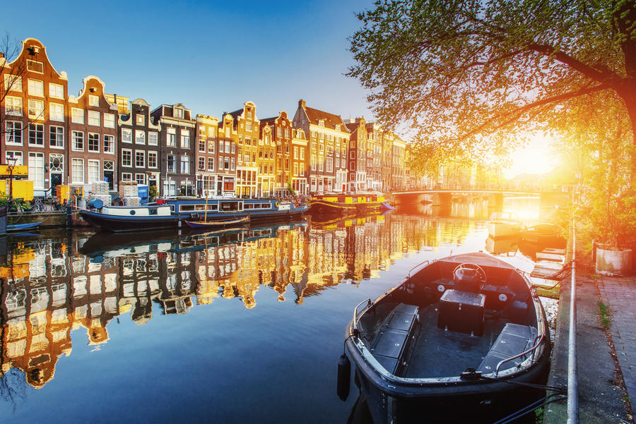 Amsterdam canal at sunset. Amsterdam is the capital and most populous city in Netherlands.