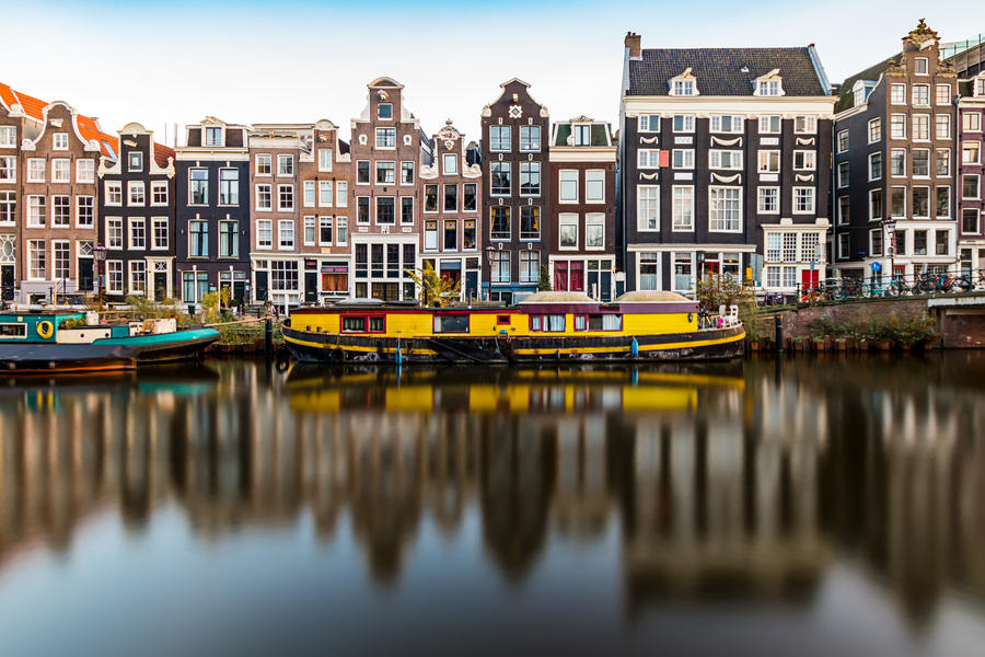 Amsterdam canal houses and houseboat