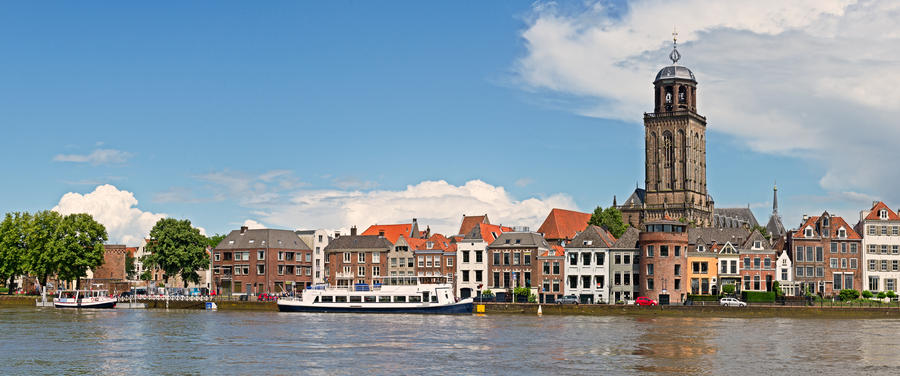 Panoramic view of the medieval Dutch city Deventer with the Great Church of Lebuines alongside the IJssel river