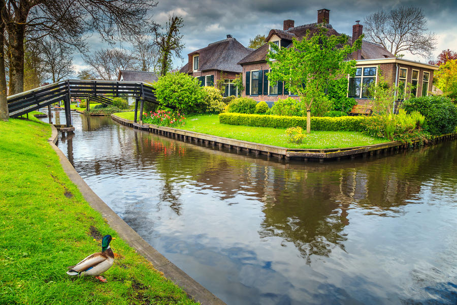 Spectacular traditional dutch village with wooden bridges and water canals, Giethoorn, Netherlands, Europe