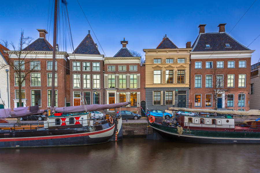 Historic boats and buildings at Hoge der Aa quay in Groningen city center, Netherlands