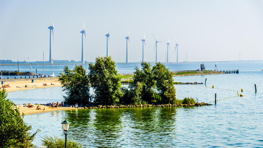 Wind Farm along the shore of the inland sea named IJselmeer seen from the historic fishing village of Urk in the Netherlands