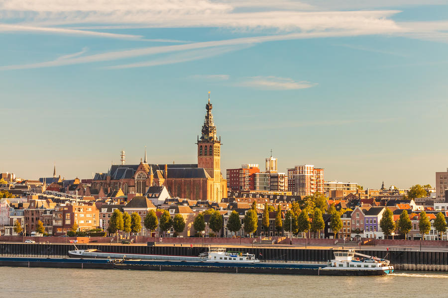 The Dutch city of Nijmegen during sunset with the river Waal in front