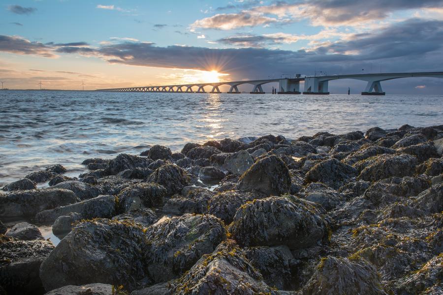 Sundown at the bridge called Zeelandbrug 
This iconic bridge connects two major parts of the province of Zeeland
City: Zierikzee
Island: Schouwen-Duiveland
Province: Zeeland
Country: Netherlands